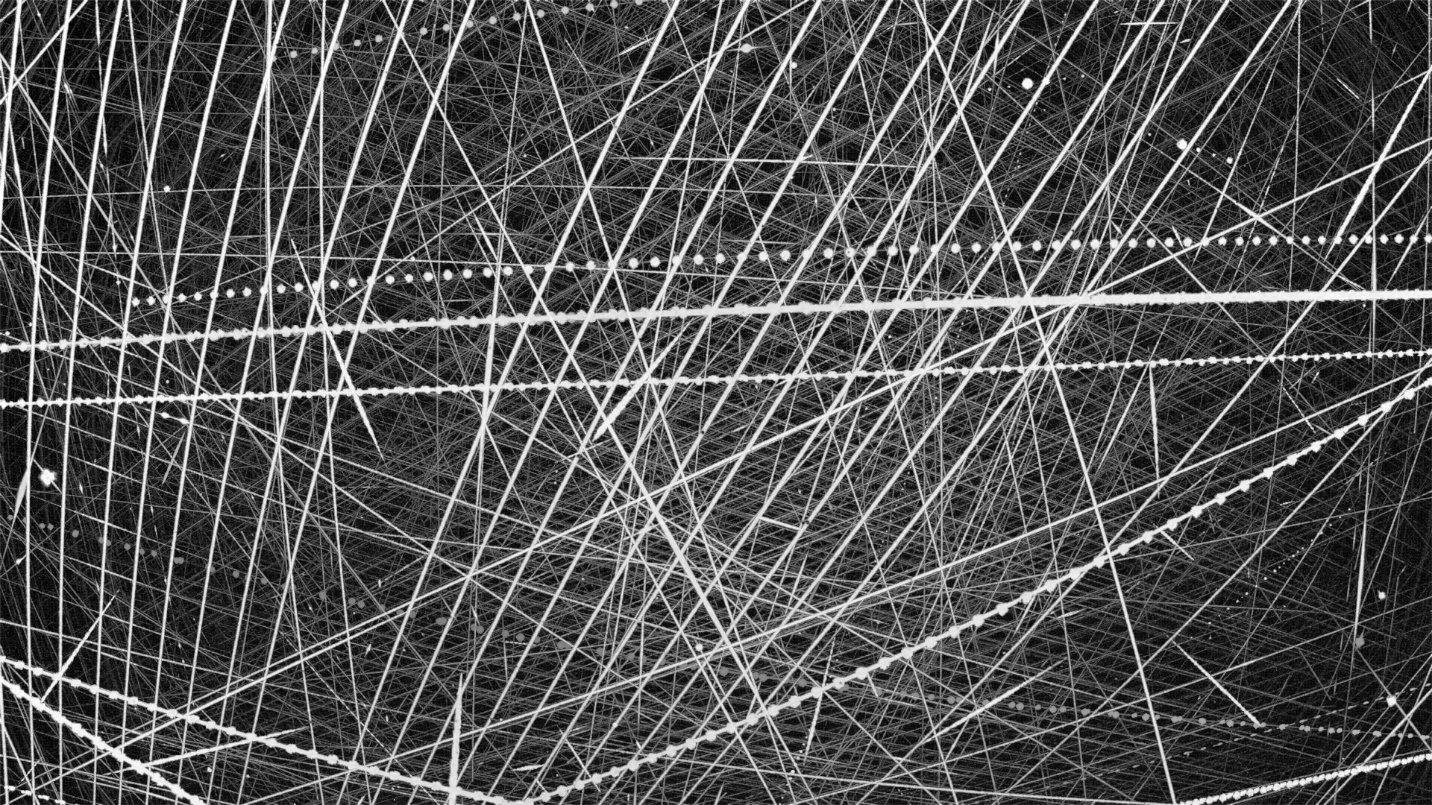 Long-exposure image of satellite and star trails over a Luciole site