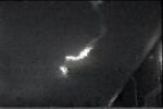 Photograph of visible meteorite trail, illuminated by sunlight.  (C) Doug Davidege.