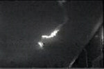 Photograph of visible meteorite trail, illuminated by sunlight.  (C) Doug Davidege.