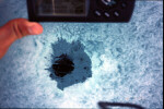 Meteorite fragment deep in ice.