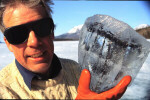 Alan Hildebrand holding ice encased disaggregated meteorite fragment.